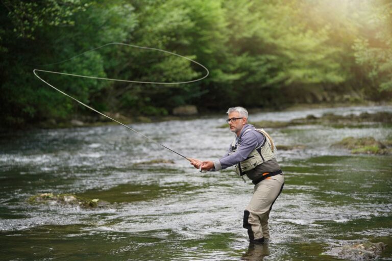 A man casting his lure to the river.