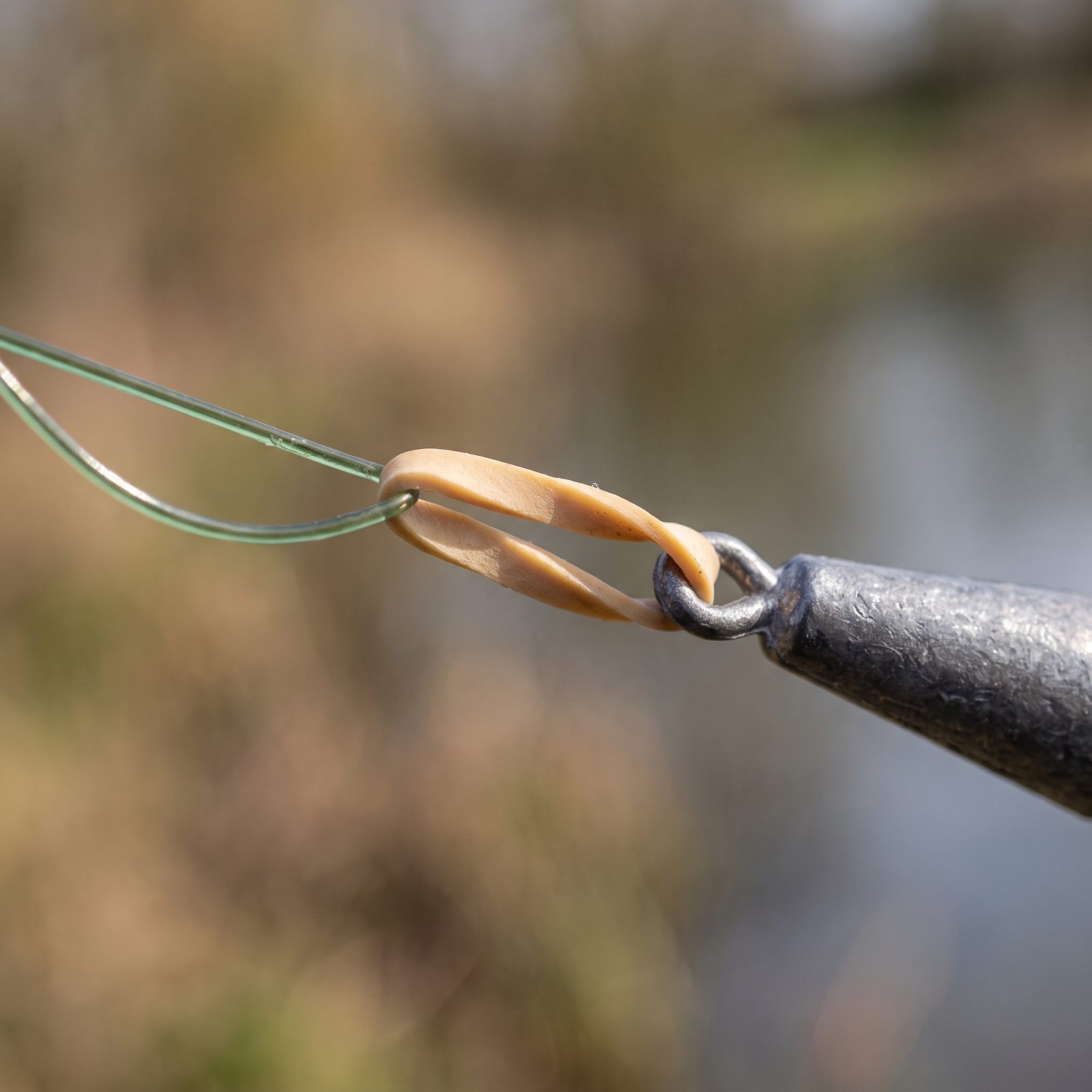 Attach Sinkers with Rubber Bands to Avoid Nicking the Line