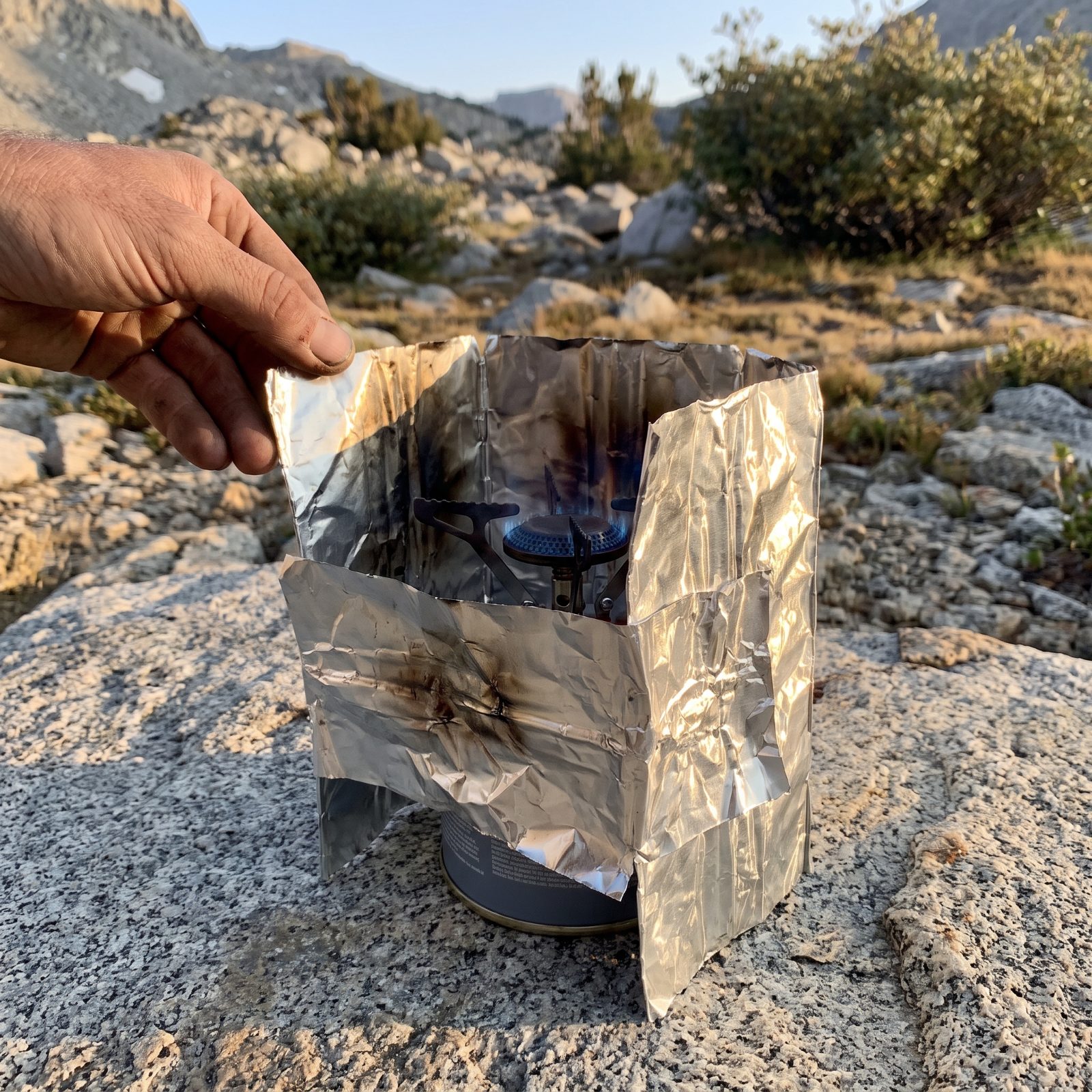 Folded Heavy-Duty Aluminum Foil, Serves as a Windscreen or Cooking Surface